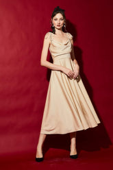Sleeveless silk midi dress with draped cowl neckline and adjustable shoulder tie straps